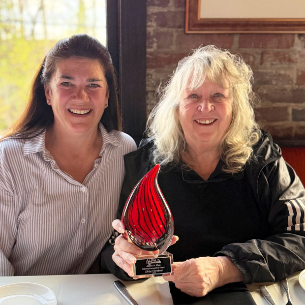 Fay Farley presenting the award to Libby Forstner